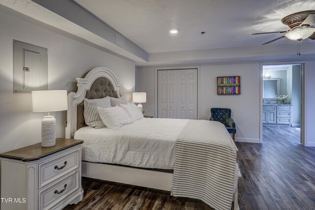 200 E Main St Unit 201, Johnson City, TN 37604 - bedroom with dark wood-type flooring, a closet, ceiling fan, connected bathroom, and recessed lighting