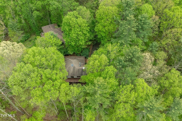birds eye view of property with a wooded view