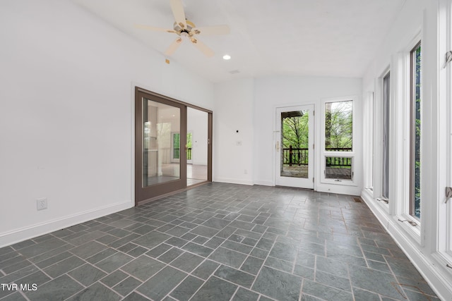 spare room featuring a ceiling fan, baseboards, recessed lighting, lofted ceiling, and stone tile flooring