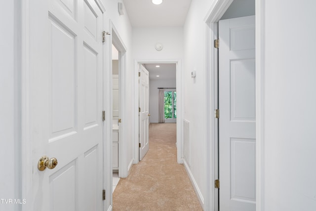 hall featuring light colored carpet, recessed lighting, baseboards, and visible vents