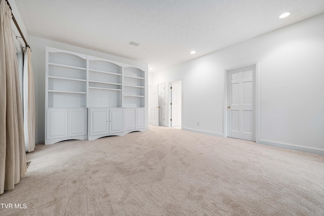 interior space featuring recessed lighting, carpet flooring, and baseboards