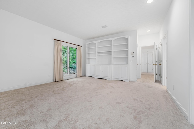 interior space featuring recessed lighting, carpet, and baseboards