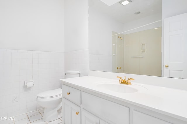 full bathroom featuring tile walls, a shower, tile patterned floors, vanity, and toilet