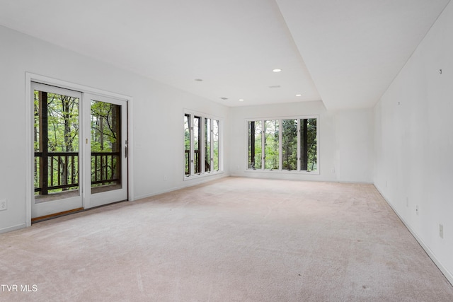 carpeted empty room with recessed lighting and baseboards