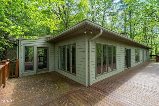 view of property exterior featuring a deck
