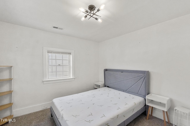 1607 E Millard St, Johnson City, TN 37601 - carpeted bedroom with baseboards, a notable chandelier, and visible vents