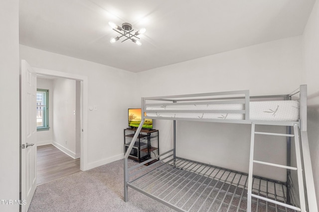 1607 E Millard St, Johnson City, TN 37601 - carpeted bedroom with an inviting chandelier and baseboards