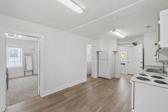 1607 E Millard St, Johnson City, TN 37601 - kitchen with a sink, light wood-style flooring, white cabinets, and white appliances