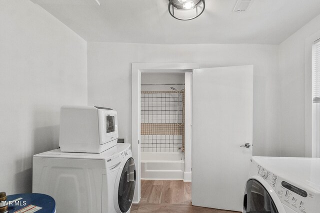 1607 E Millard St, Johnson City, TN 37601 - clothes washing area featuring laundry area, independent washer and dryer, and wood finished floors