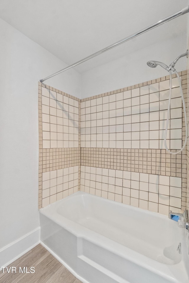1607 E Millard St, Johnson City, TN 37601 - full bath featuring baseboards, bathtub / shower combination, and wood finished floors
