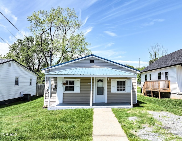 1607 E Millard St, Johnson City, TN 37601 - view of front of property with a porch, central AC unit, metal roof, and a front yard