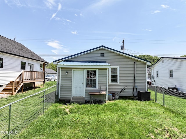 1607 E Millard St, Johnson City, TN 37601 - rear view of property featuring stairs, a fenced backyard, central AC, and a yard