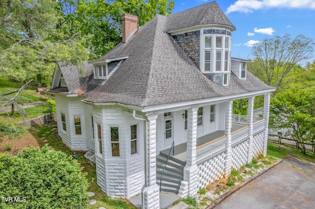 243 NW Mason Pl, Abingdon, VA 24210 - exterior space with a porch, fence, a chimney, and roof with shingles