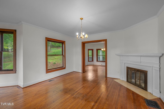 243 NW Mason Pl, Abingdon, VA 24210 - unfurnished living room with wood-type flooring, a notable chandelier, visible vents, and a wealth of natural light