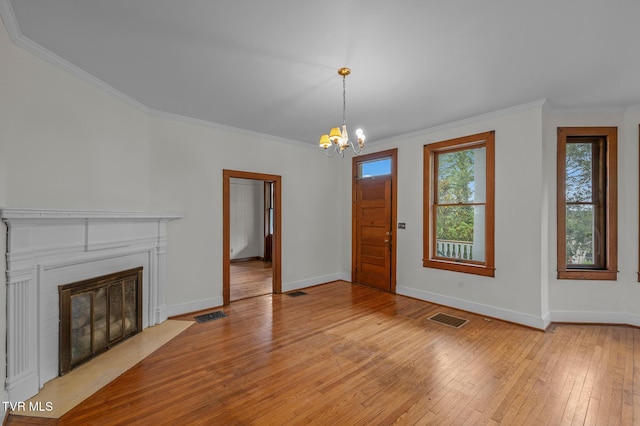 243 NW Mason Pl, Abingdon, VA 24210 - unfurnished living room with a notable chandelier, visible vents, ornamental molding, and baseboards