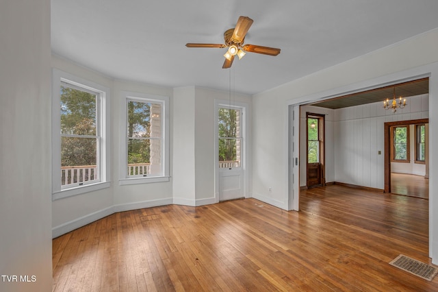 243 NW Mason Pl, Abingdon, VA 24210 - unfurnished room featuring a healthy amount of sunlight, baseboards, hardwood / wood-style floors, and visible vents