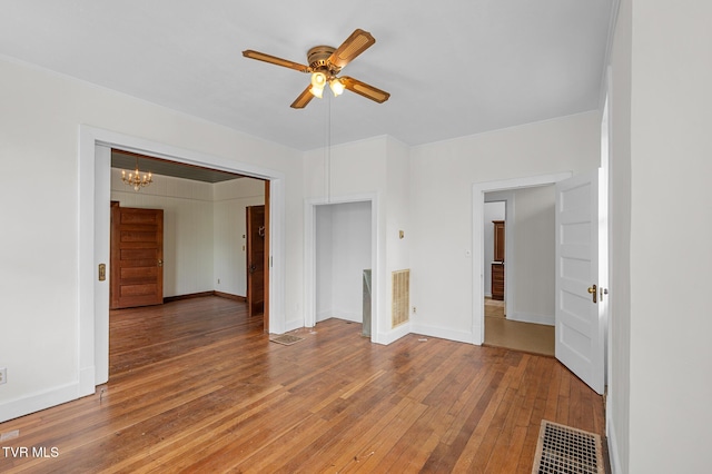 243 NW Mason Pl, Abingdon, VA 24210 - spare room featuring baseboards, ceiling fan with notable chandelier, light wood finished floors, and visible vents