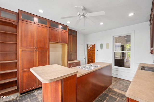 243 NW Mason Pl, Abingdon, VA 24210 - kitchen featuring a ceiling fan, a center island, light countertops, glass insert cabinets, and recessed lighting