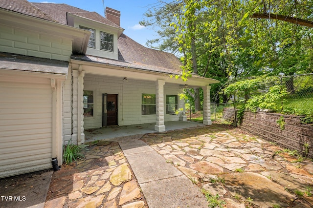 243 NW Mason Pl, Abingdon, VA 24210 - rear view of property with fence, a chimney, and a patio area