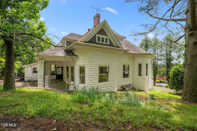 243 NW Mason Pl, Abingdon, VA 24210 - back of property featuring roof with shingles, a patio, and a chimney