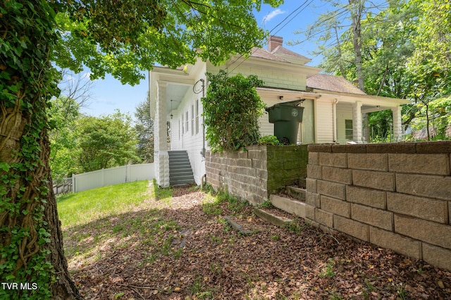 243 NW Mason Pl, Abingdon, VA 24210 - view of side of home featuring fence and a chimney