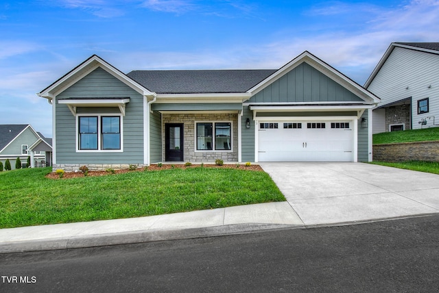 73 Slonaker Cir, Jonesborough, TN 37659 - craftsman-style house with board and batten siding, an attached garage, a front lawn, and driveway