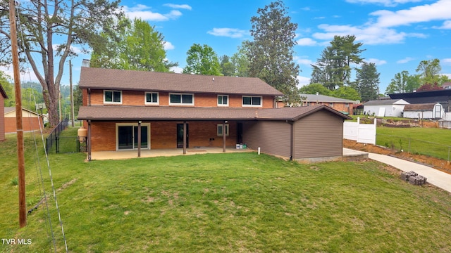 3749 Hemlock Park Cir, Kingsport, TN 37663 - view of front of home with a front lawn, fence, a patio, a chimney, and brick siding