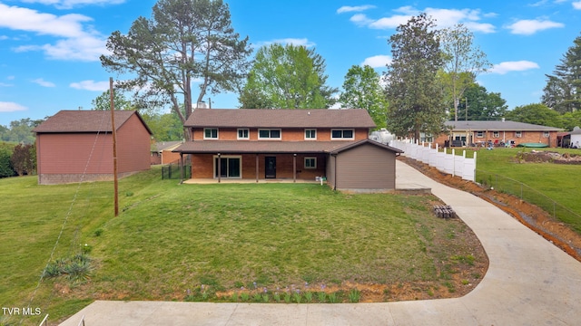 3749 Hemlock Park Cir, Kingsport, TN 37663 - view of front of house with fence, a patio, and a front lawn