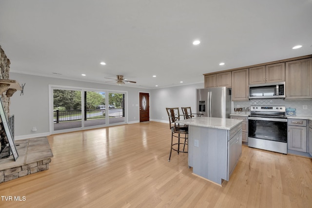 3749 Hemlock Park Cir, Kingsport, TN 37663 - kitchen with appliances with stainless steel finishes, baseboards, open floor plan, a kitchen bar, and backsplash