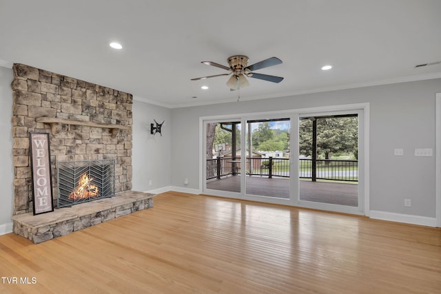 3749 Hemlock Park Cir, Kingsport, TN 37663 - unfurnished living room with crown molding, light wood-style flooring, baseboards, and a stone fireplace