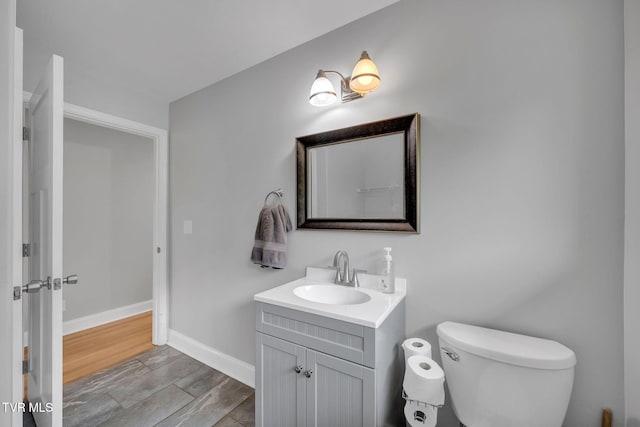 3749 Hemlock Park Cir, Kingsport, TN 37663 - bathroom featuring vanity, baseboards, and toilet