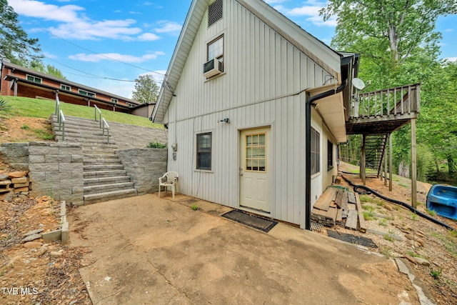 3749 Hemlock Park Cir, Kingsport, TN 37663 - rear view of house featuring board and batten siding, a deck, cooling unit, and stairs