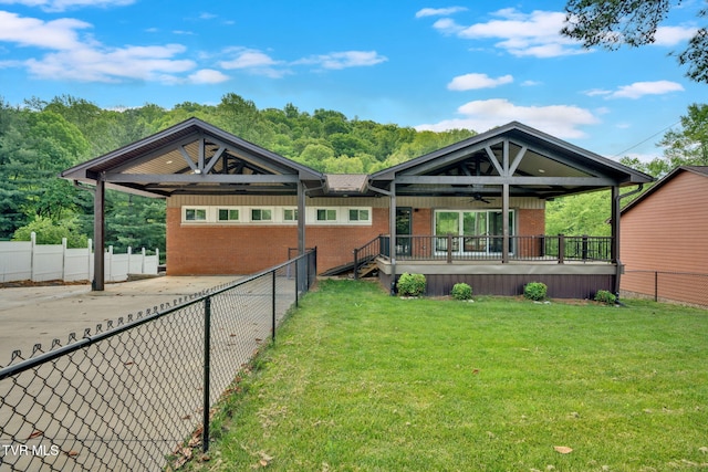 3749 Hemlock Park Cir, Kingsport, TN 37663 - back of property featuring brick siding, a ceiling fan, a fenced backyard, and a yard