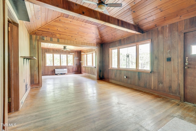 357 Webb Rd, Piney Flats, TN 37686 - unfurnished living room featuring wooden walls, ceiling fan, wood-type flooring, and lofted ceiling with beams