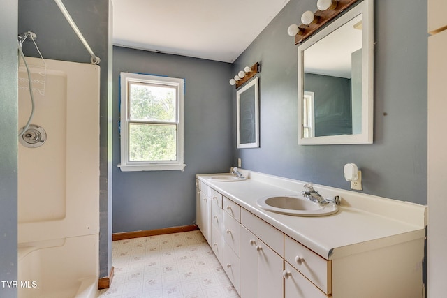 357 Webb Rd, Piney Flats, TN 37686 - full bathroom featuring double vanity, tile patterned floors, walk in shower, and a sink