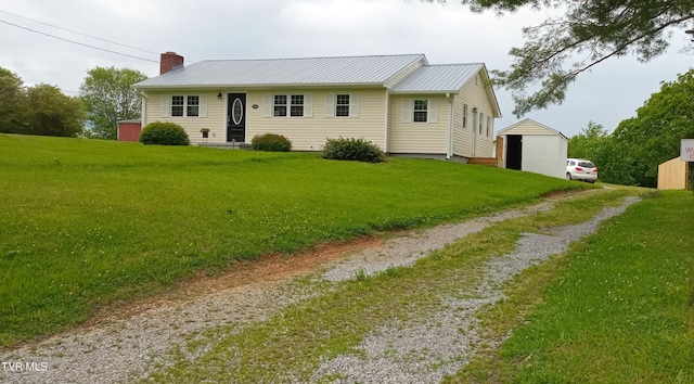 2160 Whirlwind Rd, Greeneville, TN 37743 - view of front of property featuring a garage, a front lawn, an outbuilding, and driveway