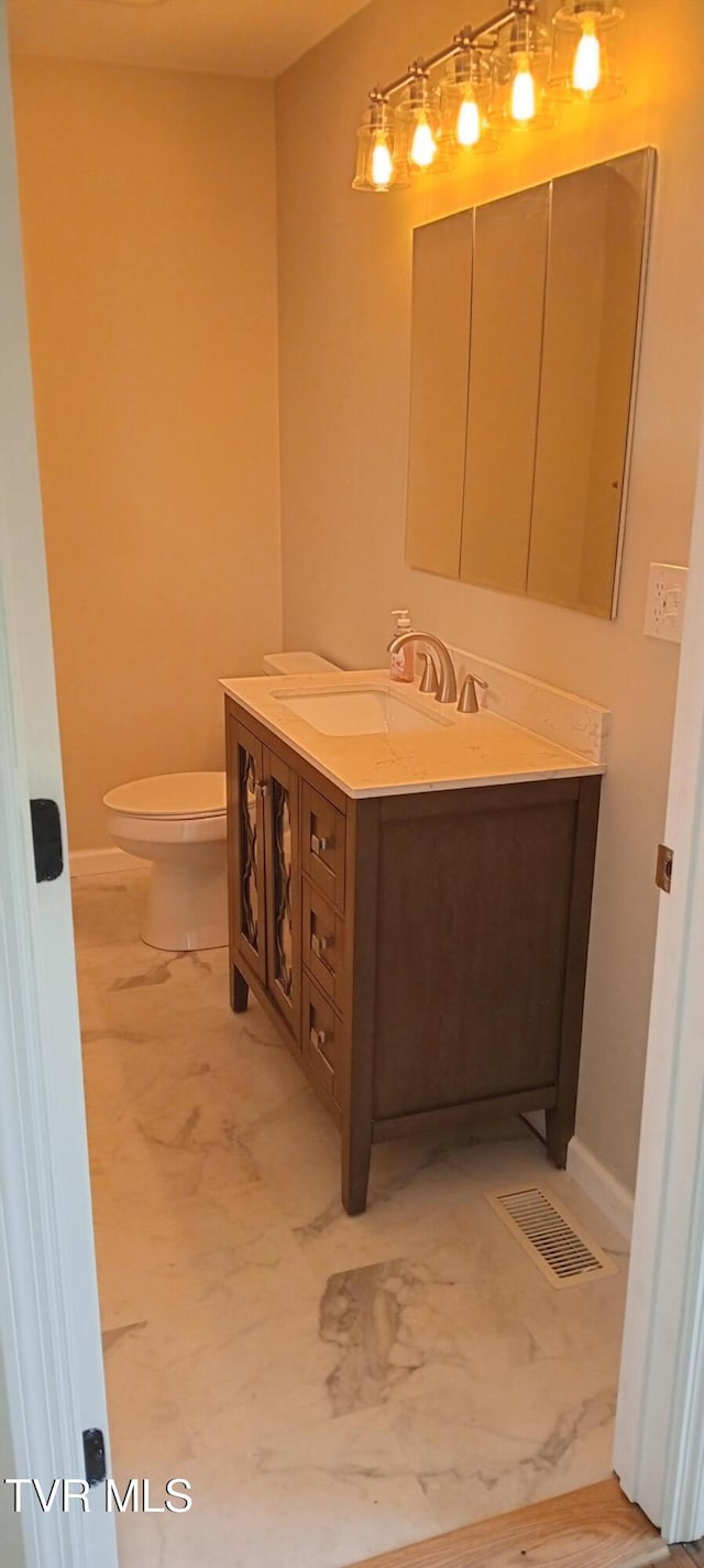 2160 Whirlwind Rd, Greeneville, TN 37743 - bathroom with toilet, visible vents, baseboards, and vanity