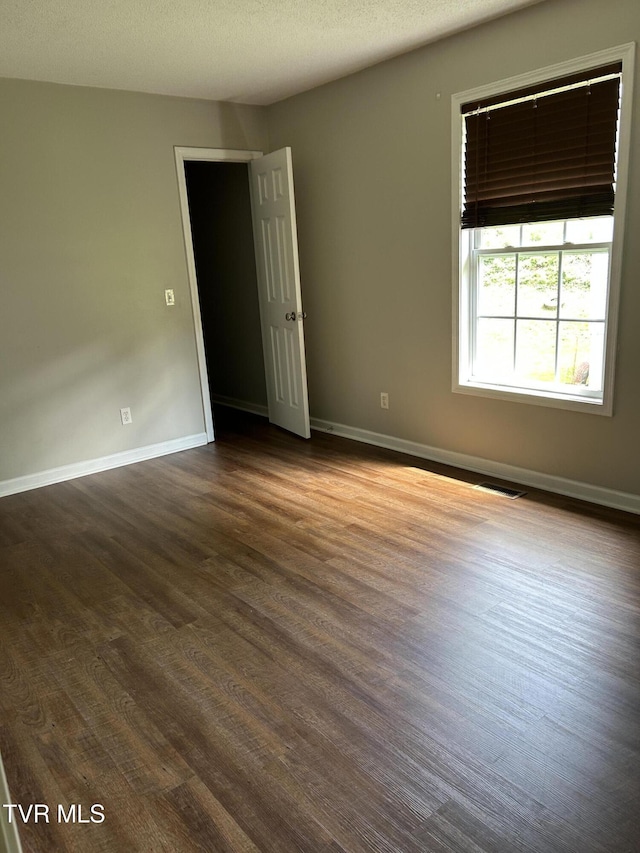 608 Walnut St, Elizabethton, TN 37643 - unfurnished room featuring dark wood-style flooring and baseboards