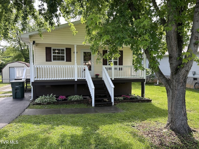 608 Walnut St, Elizabethton, TN 37643 - view of front of house with covered porch, a front yard, an outdoor structure, and stairs