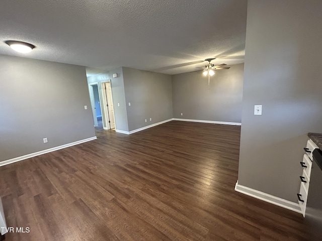 608 Walnut St, Elizabethton, TN 37643 - spare room with ceiling fan, dark wood-style flooring, a textured ceiling, and baseboards