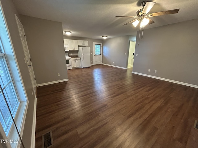 608 Walnut St, Elizabethton, TN 37643 - unfurnished living room with ceiling fan, baseboards, and dark wood-style flooring