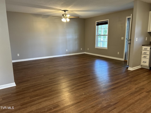 608 Walnut St, Elizabethton, TN 37643 - empty room featuring ceiling fan, dark wood-style floors, and baseboards