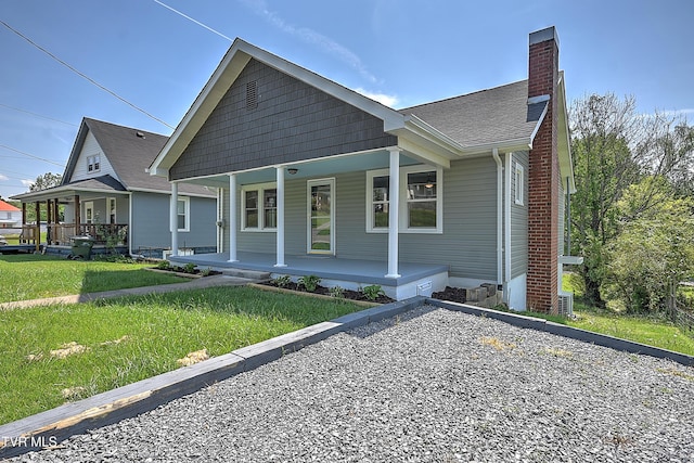350 Texas Ave, Bristol, VA 24201 - bungalow with roof with shingles, covered porch, a chimney, and a front yard