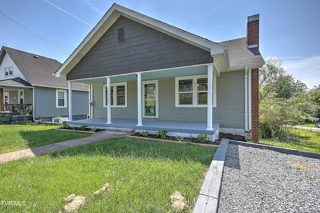 350 Texas Ave, Bristol, VA 24201 - bungalow with covered porch, a chimney, and a front yard