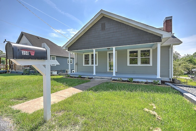 350 Texas Ave, Bristol, VA 24201 - bungalow-style house with a porch, a front lawn, and a chimney