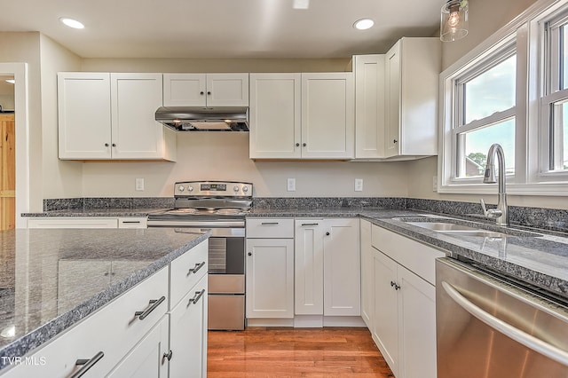 350 Texas Ave, Bristol, VA 24201 - kitchen featuring range hood, recessed lighting, white cabinetry, a sink, and stainless steel appliances