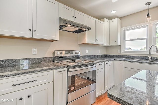 350 Texas Ave, Bristol, VA 24201 - kitchen featuring stainless steel electric range oven, a sink, white cabinets, under cabinet range hood, and light wood-style flooring