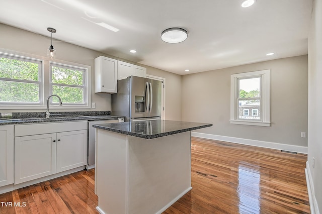 350 Texas Ave, Bristol, VA 24201 - kitchen featuring plenty of natural light, stainless steel appliances, light wood finished floors, and dark stone countertops