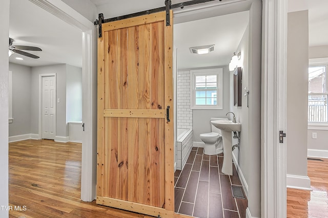350 Texas Ave, Bristol, VA 24201 - bathroom featuring visible vents, a ceiling fan, baseboards, and wood finished floors