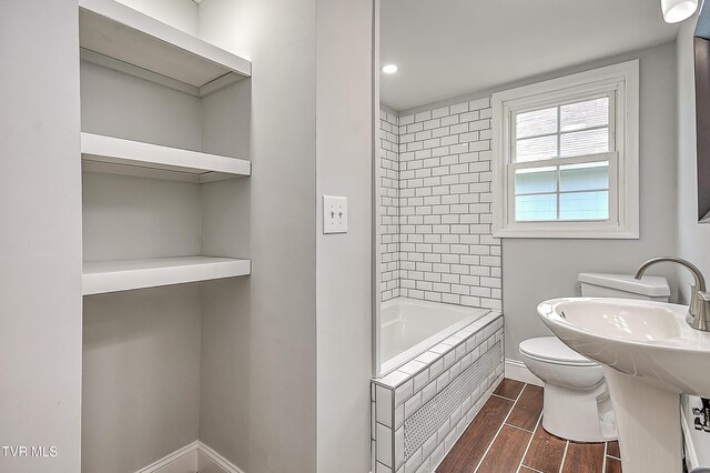 350 Texas Ave, Bristol, VA 24201 - bathroom featuring walk in shower, wood finished floors, baseboards, toilet, and a tub to relax in
